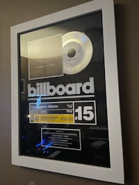 a framed cd with the word billboard on it